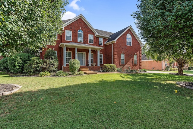 4115 Chancellor Dr, Thompsons Station, TN 37179 - traditional-style home with a front lawn and brick siding