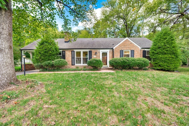 ranch-style home featuring a front yard