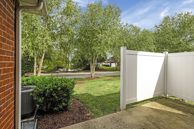 view of yard with central AC