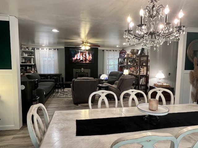 dining space with ceiling fan and hardwood / wood-style flooring