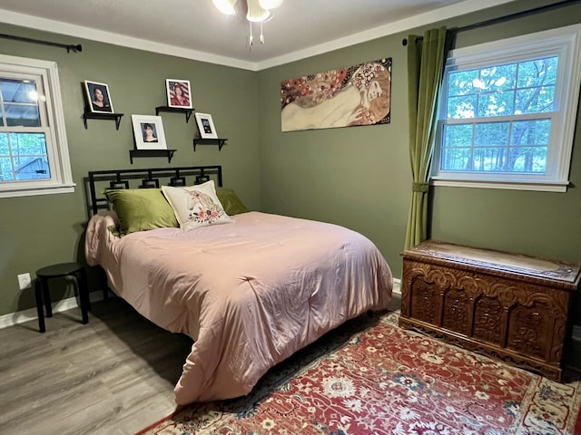 bedroom with hardwood / wood-style floors