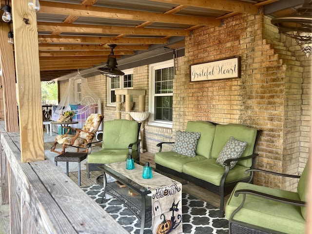 wooden deck with an outdoor living space