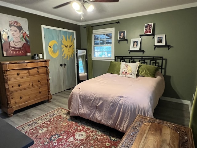 bedroom with ceiling fan and light wood-type flooring