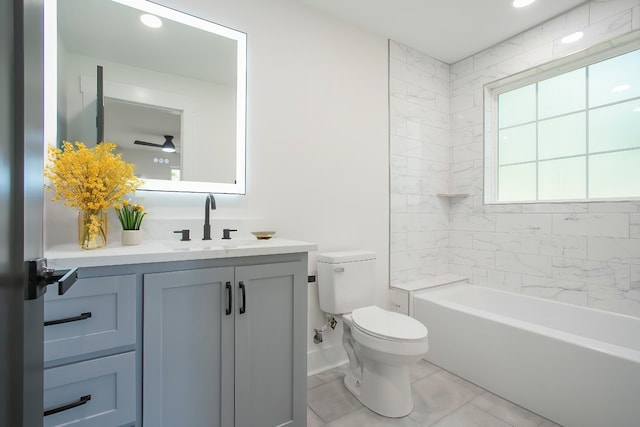 full bathroom with vanity, tiled shower / bath combo, ceiling fan, toilet, and tile patterned floors