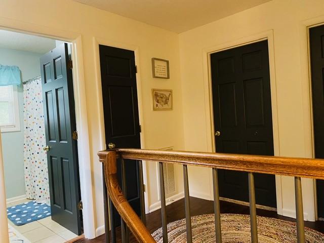 hall with tile patterned flooring