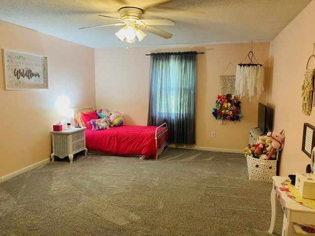 bedroom featuring a textured ceiling, carpet, and ceiling fan