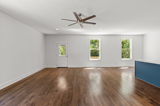 interior space featuring ceiling fan and dark wood-type flooring