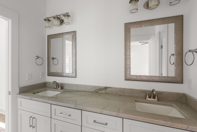 bathroom featuring a healthy amount of sunlight and vanity