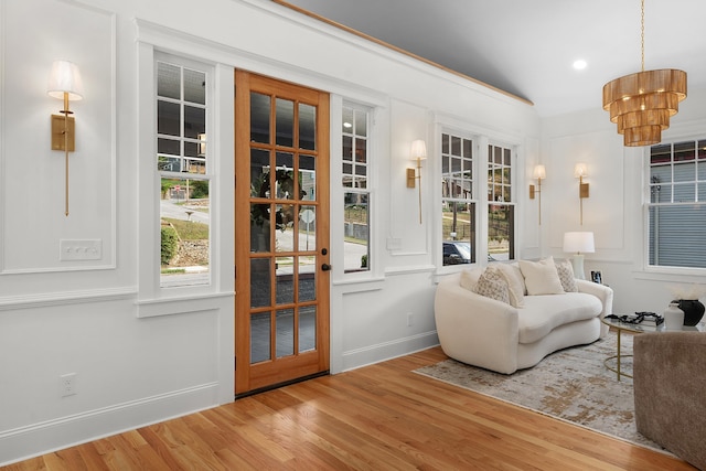 living room featuring hardwood / wood-style floors and a notable chandelier