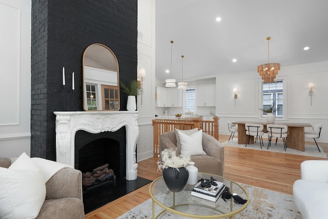 living room featuring light wood-type flooring and sink