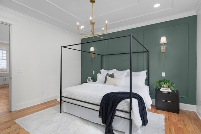 bedroom featuring hardwood / wood-style flooring and crown molding