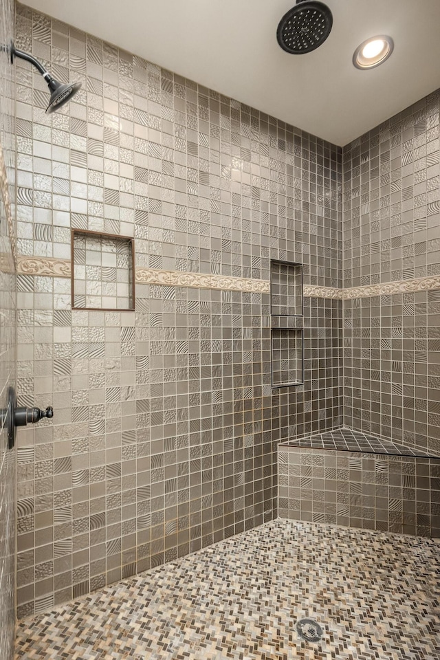 bathroom with a tile shower