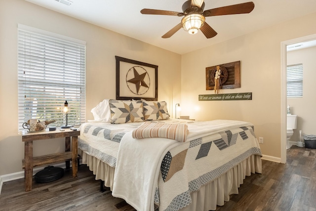 bedroom with connected bathroom, ceiling fan, and dark hardwood / wood-style floors