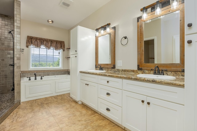 bathroom with vanity, plus walk in shower, and tile patterned flooring