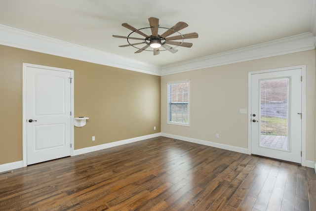 empty room with ceiling fan, ornamental molding, a wealth of natural light, and dark hardwood / wood-style floors