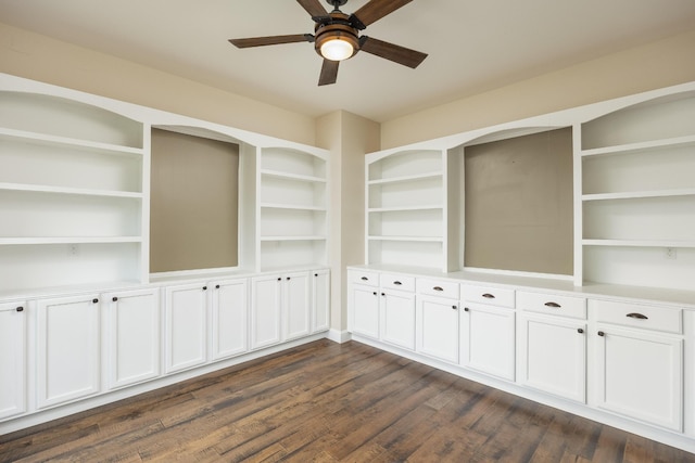 empty room featuring ceiling fan and dark hardwood / wood-style flooring