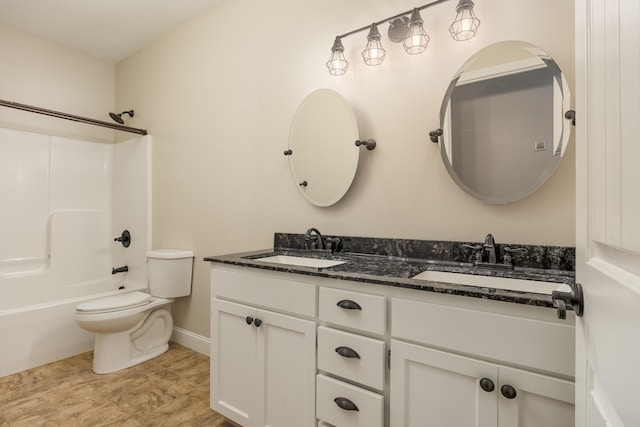 full bathroom with toilet, vanity, and shower / bathtub combination