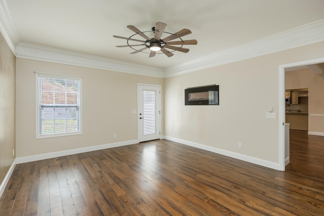 spare room with ornamental molding, ceiling fan, and dark hardwood / wood-style flooring