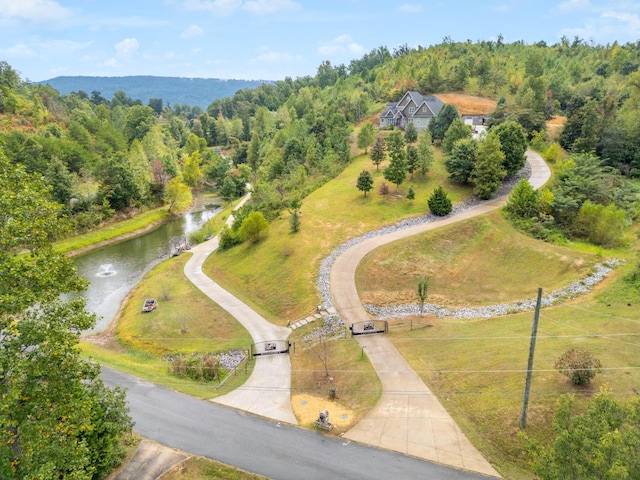 birds eye view of property featuring a water view