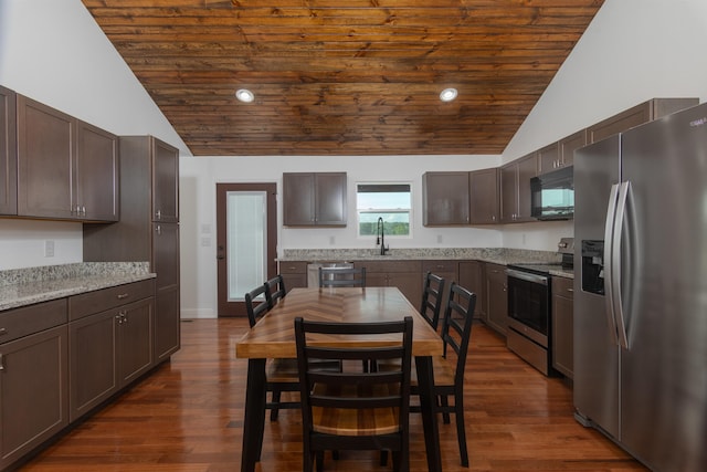 kitchen featuring light stone countertops, appliances with stainless steel finishes, dark hardwood / wood-style flooring, and wood ceiling