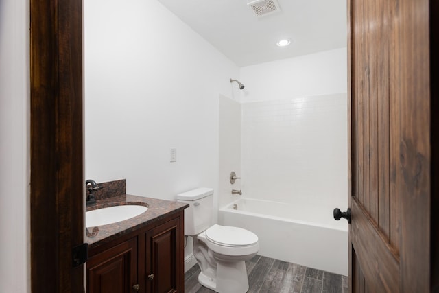 full bathroom with wood-type flooring, vanity, toilet, and  shower combination