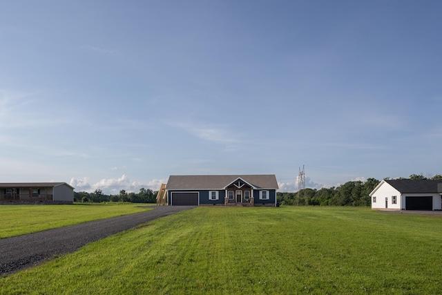 ranch-style house with a front yard and a garage