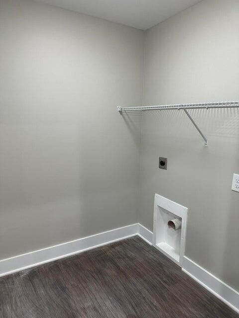 laundry area featuring dark hardwood / wood-style flooring and hookup for an electric dryer