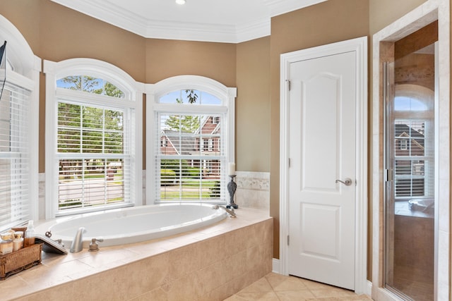 bathroom featuring independent shower and bath, crown molding, and a wealth of natural light