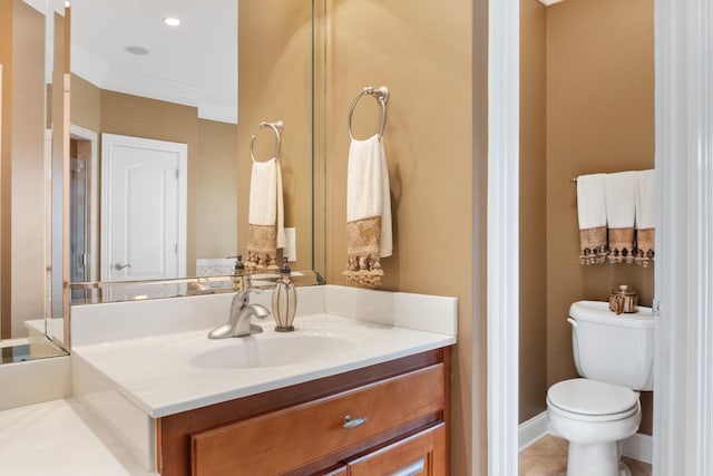 bathroom featuring crown molding, tile patterned flooring, vanity, and toilet