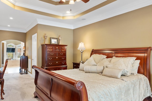 bedroom with light carpet, ornamental molding, and ceiling fan