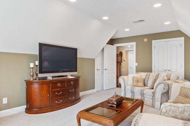 living room featuring vaulted ceiling and light colored carpet