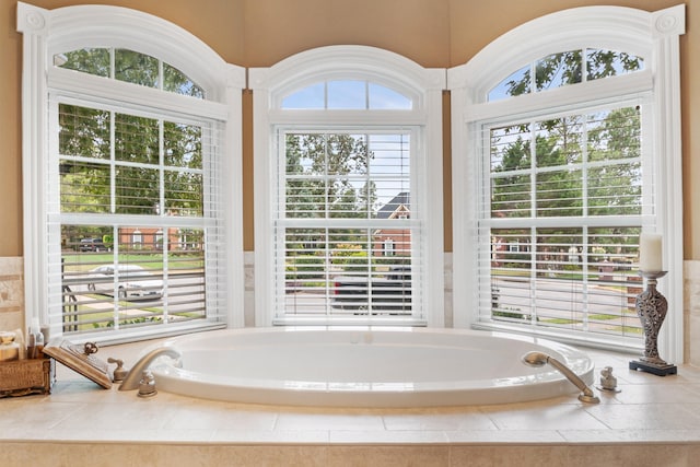 bathroom with tiled tub