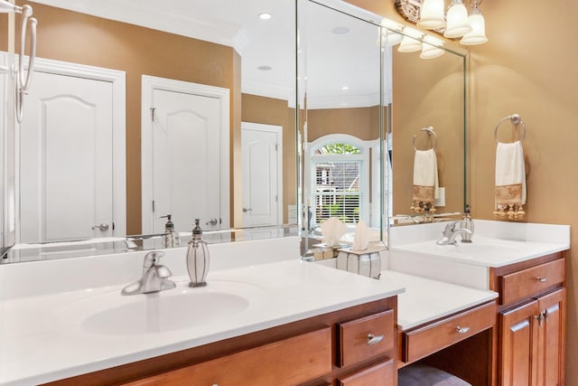 bathroom featuring ornamental molding, recessed lighting, and vanity