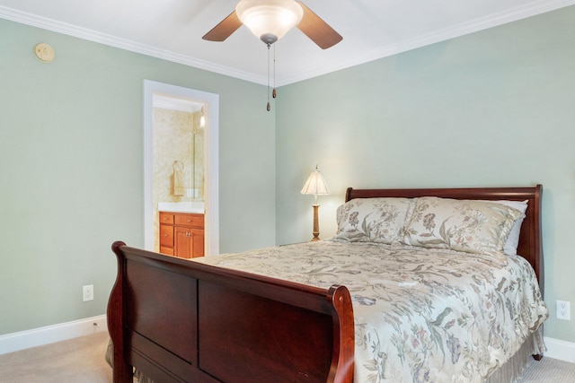 bedroom featuring light carpet, ensuite bath, crown molding, and ceiling fan