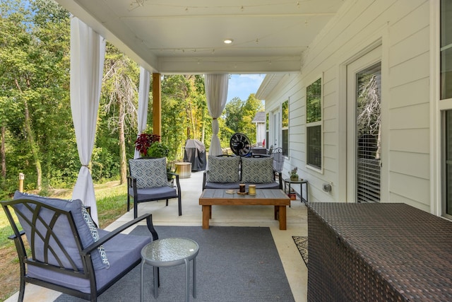 view of patio featuring grilling area and a porch