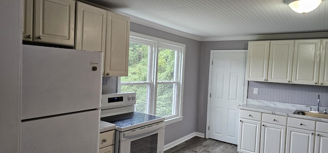 kitchen with dark wood-type flooring, sink, white cabinets, white appliances, and ornamental molding