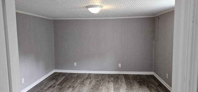 unfurnished room featuring crown molding and dark wood-type flooring