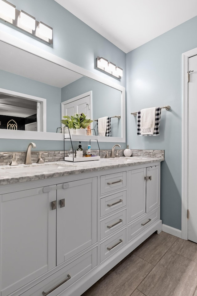 bathroom featuring wood-type flooring and vanity