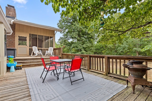 wooden terrace with a sunroom