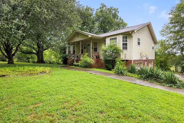 view of front of home with a front yard and covered porch