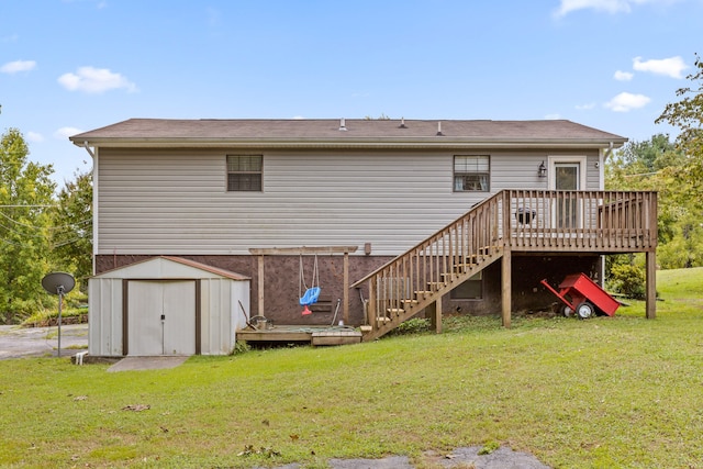 rear view of property with a lawn, a storage unit, and a deck