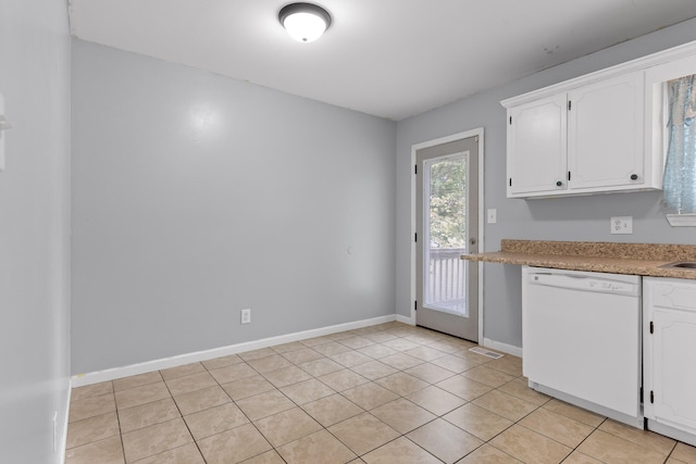 kitchen with dishwasher, light tile patterned floors, and white cabinetry