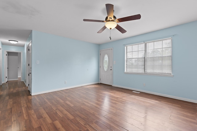 interior space featuring ceiling fan and dark wood-type flooring