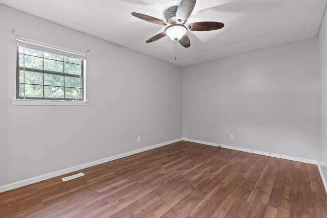 empty room featuring wood-type flooring and ceiling fan