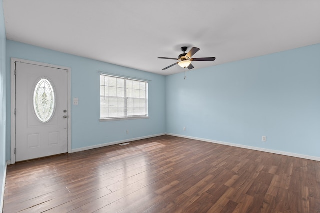 foyer entrance with dark hardwood / wood-style floors and ceiling fan