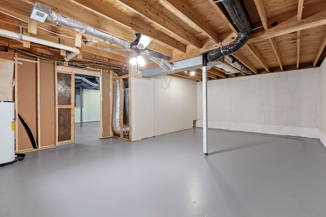 basement featuring gas water heater and ceiling fan