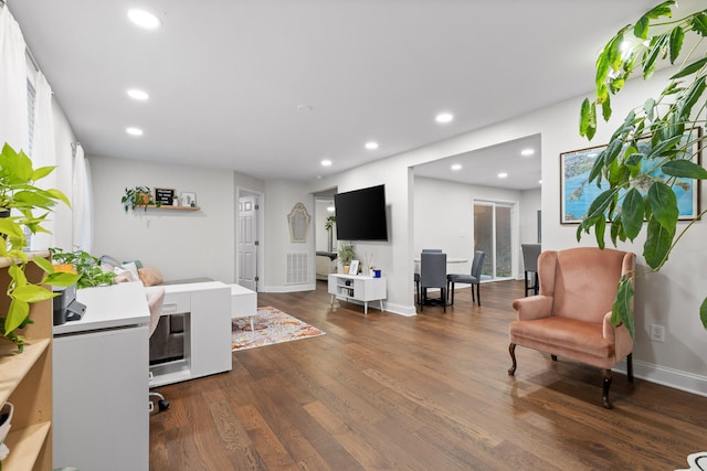 living room featuring dark hardwood / wood-style floors