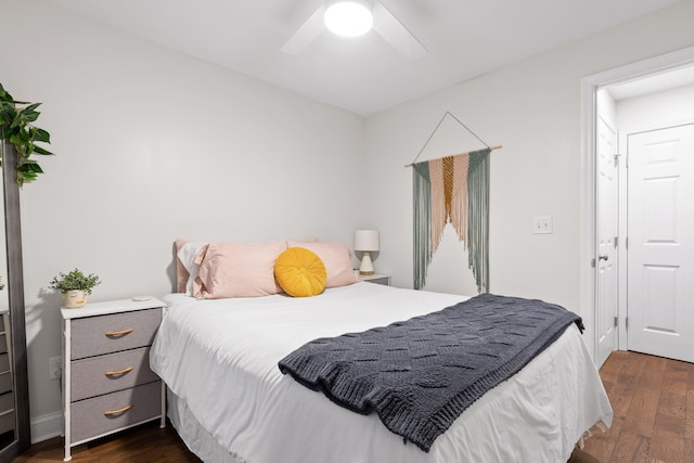 bedroom featuring ceiling fan and dark wood-type flooring