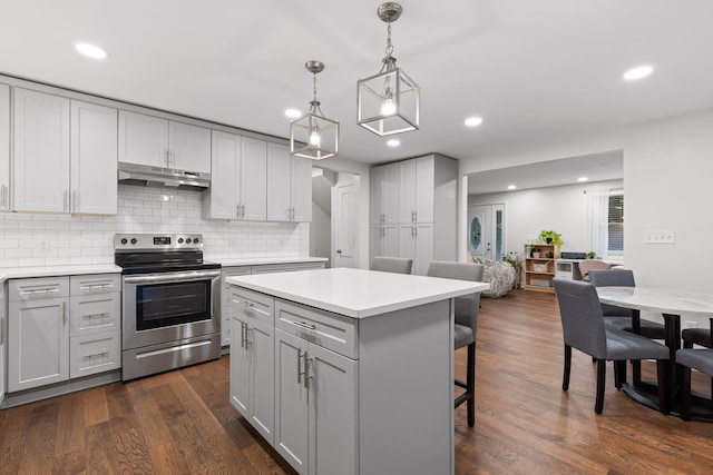 kitchen featuring gray cabinets, decorative light fixtures, stainless steel electric range oven, and dark hardwood / wood-style floors