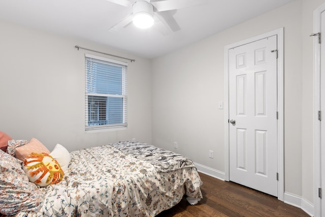 bedroom featuring ceiling fan and dark wood-type flooring